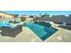 Stunning pool with a spacious deck and patio furniture at 14877 N 145Th Dr, Surprise, AZ 85379