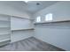 Spacious walk-in closet with ample shelving at 14877 N 145Th Dr, Surprise, AZ 85379