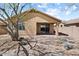 Spacious backyard, featuring a covered patio and grassy area at 1719 W Owens Way, Anthem, AZ 85086
