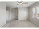 Bedroom with double door closet and window at 1719 W Owens Way, Anthem, AZ 85086