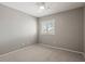 Bright bedroom with carpeted floor, ceiling fan, and window shutters at 1719 W Owens Way, Anthem, AZ 85086