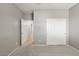 Spacious bedroom with double door closet and access to hallway at 1719 W Owens Way, Anthem, AZ 85086
