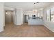 Open dining area with kitchen island and tile flooring at 1719 W Owens Way, Anthem, AZ 85086