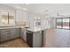 Open kitchen features granite counters and island at 1719 W Owens Way, Anthem, AZ 85086