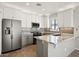 Modern kitchen with granite countertops and stainless steel appliances at 1719 W Owens Way, Anthem, AZ 85086