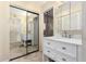Updated bathroom with white vanity, marble countertop and large mirror at 178 Leisure World --, Mesa, AZ 85206