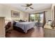 Primary bedroom with patio access and ceiling fan at 178 Leisure World --, Mesa, AZ 85206