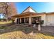 Single story home with covered patio and grassy backyard at 178 Leisure World --, Mesa, AZ 85206
