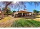 Single story home with covered patio and grassy backyard at 178 Leisure World --, Mesa, AZ 85206