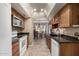 Eat-in kitchen with granite counters & wood cabinets at 178 Leisure World --, Mesa, AZ 85206