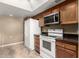 White appliances and granite countertops in kitchen at 178 Leisure World --, Mesa, AZ 85206