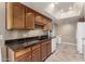 Bright kitchen with granite countertops and wood cabinets at 178 Leisure World --, Mesa, AZ 85206