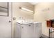 Laundry room with washer, dryer, and overhead lighting at 178 Leisure World --, Mesa, AZ 85206