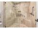 Walk-in shower with glass enclosure, built-in seat, and modern fixtures at 178 Leisure World --, Mesa, AZ 85206