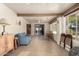 Bright sunroom with tile flooring, seating area, and sliding glass doors at 178 Leisure World --, Mesa, AZ 85206