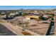 Aerial view of a house with solar panels and a large fenced yard at 18706 W Arlington Rd, Buckeye, AZ 85326