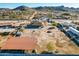 Aerial view of single story home with large lot and mountain views at 18706 W Arlington Rd, Buckeye, AZ 85326