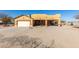 House exterior featuring a two-car garage and covered porch at 18706 W Arlington Rd, Buckeye, AZ 85326