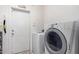 Laundry room with washer, dryer, and exterior access at 18706 W Arlington Rd, Buckeye, AZ 85326