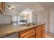 Modern kitchen with granite countertops and stainless steel sink at 200 E Southern Ave # 222, Tempe, AZ 85282