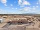 Aerial view of a single-story home with a large yard and desert landscape at 20343 W Morning Vista Dr, Wittmann, AZ 85361