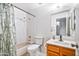 This bathroom includes a shower-tub combo, framed mirror, and wooden vanity at 2315 W Union Hills Dr # 115, Phoenix, AZ 85027