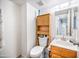A functional bathroom design with a toilet, vanity, and cabinet space, offering practicality and convenience at 2315 W Union Hills Dr # 115, Phoenix, AZ 85027