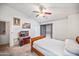 A bright bedroom with a ceiling fan, offering a comfortable and private space for rest and relaxation at 2315 W Union Hills Dr # 115, Phoenix, AZ 85027