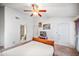 A comfortable bedroom featuring a ceiling fan, closet, and a cozy atmosphere, perfect for rest and relaxation at 2315 W Union Hills Dr # 115, Phoenix, AZ 85027