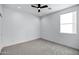 Spacious bedroom with ceiling fan and neutral carpeting at 2330 N 28Th Pl, Phoenix, AZ 85008