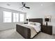 Spacious bedroom with plush carpet, large windows, and modern furniture at 2330 N 28Th Pl, Phoenix, AZ 85008