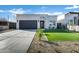 Modern home with gray garage door, landscaped lawn, and clean lines at 2330 N 28Th Pl, Phoenix, AZ 85008