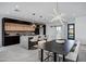 Modern kitchen with island, dining area, and open floor plan at 2330 N 28Th Pl, Phoenix, AZ 85008