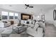 Spacious living room with L-shaped sofa, modern coffee table, and open floor plan at 2330 N 28Th Pl, Phoenix, AZ 85008