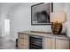 Built-in wet bar with wine cooler, perfect for entertaining at 2330 N 28Th Pl, Phoenix, AZ 85008