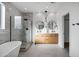 Modern bathroom with marble tile, double vanity, and large shower at 2336 N 28Th Pl, Phoenix, AZ 85008