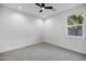 Spacious bedroom with gray carpet and window at 2336 N 28Th Pl, Phoenix, AZ 85008