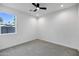 Bright bedroom with gray carpet and ceiling fan at 2336 N 28Th Pl, Phoenix, AZ 85008