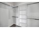 Bright walk-in closet with ample shelving and hanging space at 2336 N 28Th Pl, Phoenix, AZ 85008