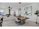 Elegant dining room features a rustic wood table and modern lighting at 2336 N 28Th Pl, Phoenix, AZ 85008