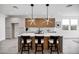 Modern kitchen features a large island with seating and wood cabinets at 2336 N 28Th Pl, Phoenix, AZ 85008