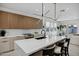 Modern kitchen with a large island and wood cabinets at 2336 N 28Th Pl, Phoenix, AZ 85008