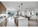 Modern kitchen with island, stainless steel appliances, and breakfast bar at 2336 N 28Th Pl, Phoenix, AZ 85008