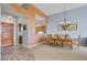 Dining area with wood table and chairs, view to kitchen and entryway at 25615 N Bolero Bnd # 2, Rio Verde, AZ 85263