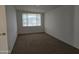 Simple bedroom with carpet and window coverings at 2650 W Union Hills Dr # 33, Phoenix, AZ 85027