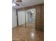Bright bedroom with mirrored closet doors and laminate flooring at 2650 W Union Hills Dr # 33, Phoenix, AZ 85027