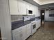 White cabinets, blue countertop kitchen with appliances at 2650 W Union Hills Dr # 33, Phoenix, AZ 85027