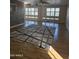 Spacious living room featuring wood-look floors and a large area rug at 2650 W Union Hills Dr # 33, Phoenix, AZ 85027