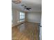 Bright and airy living room with laminate flooring and window shutters at 2650 W Union Hills Dr # 33, Phoenix, AZ 85027