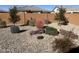 Landscaped backyard with desert plants and gravel at 26810 W Melinda Ln, Buckeye, AZ 85396